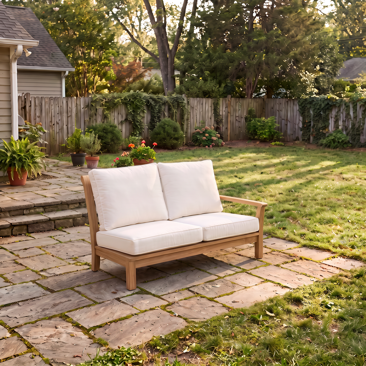 Kingsley Bate Chelsea teak sectional right arm facing settee with white cushions on a backyard patio