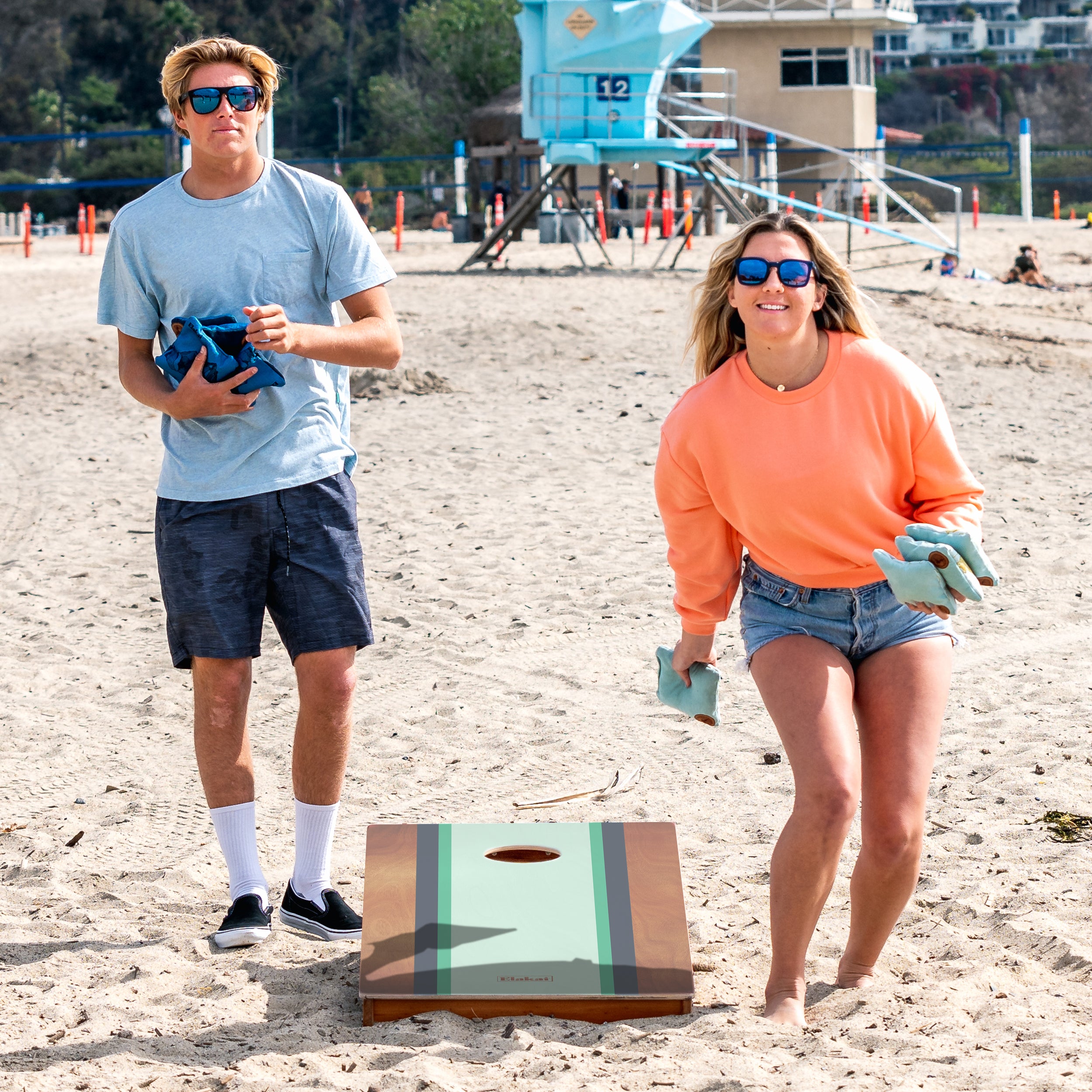 Elakai Gidget Surf Cornhole board game on the beach
